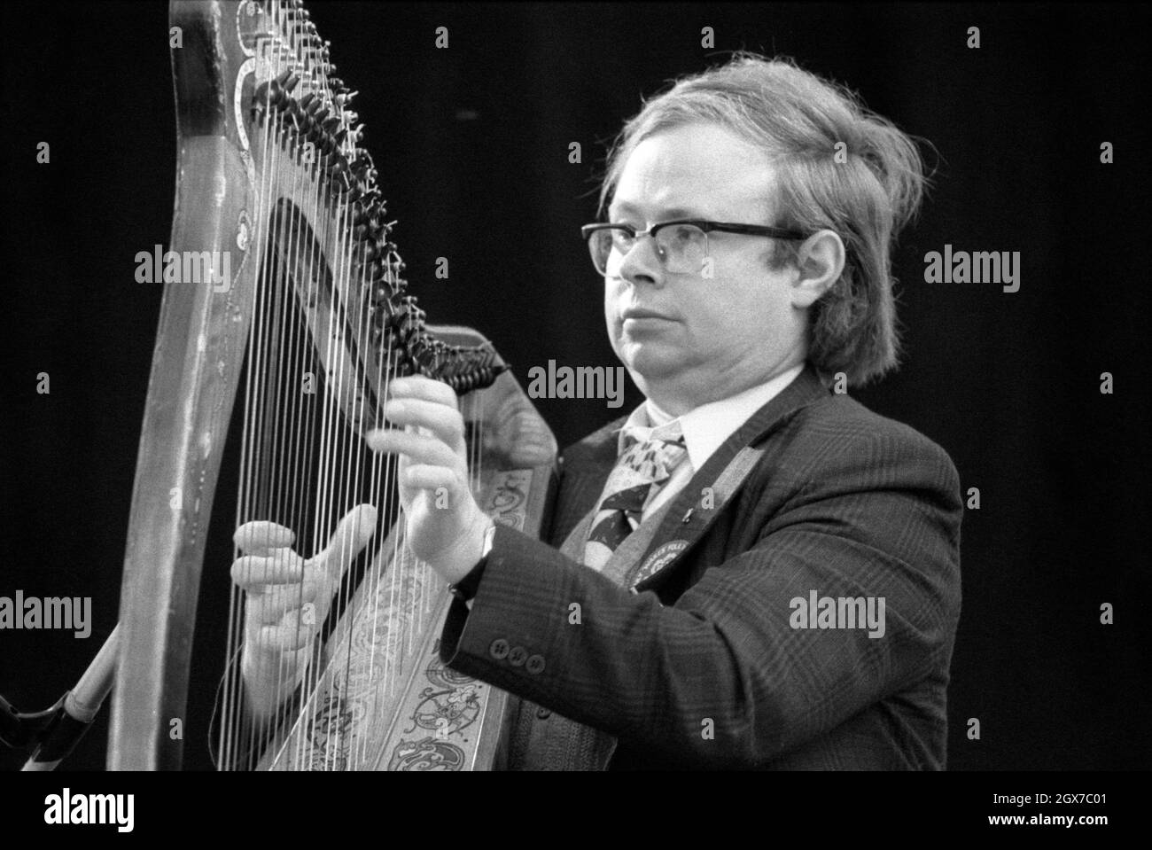 Harpist Derek Bell, MBE performing with The Chieftains at the July Wakes folk festival in Chorley, Lancashire, England on 25 July 1976. Stock Photo
