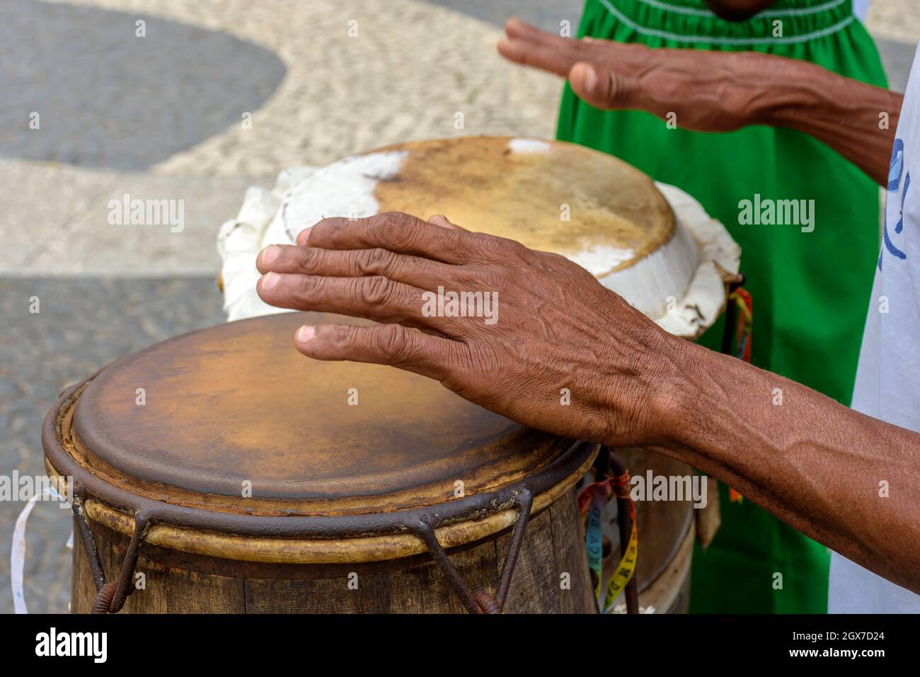 Percussionist playing a rudimentary atabaque during afro-brazilian cultural manifestation at Pelourinho on Salvador city, Bahia Stock Photo