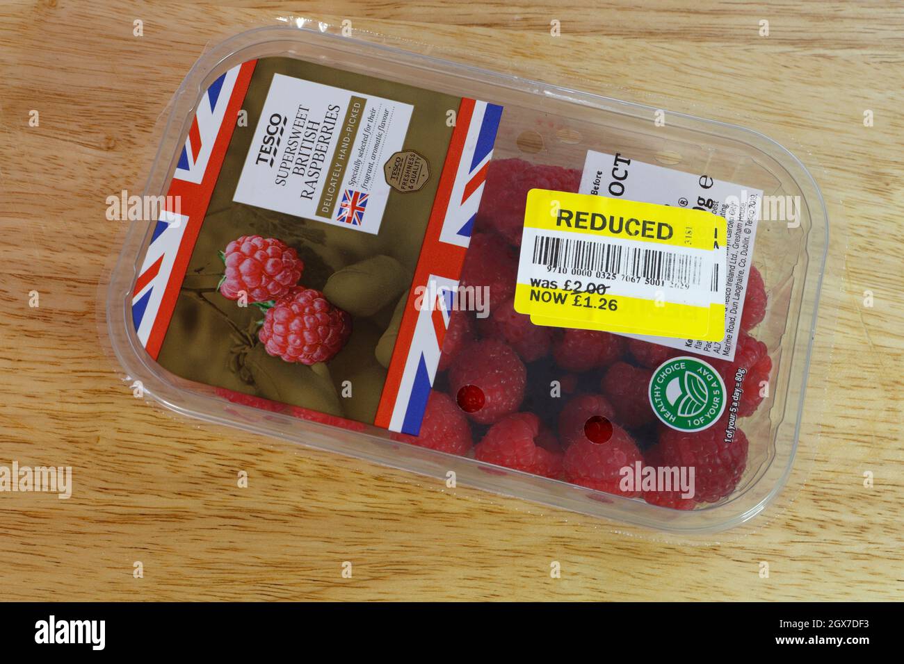Pack of Tesco Raspberries, with price reduced sticker Stock Photo Alamy