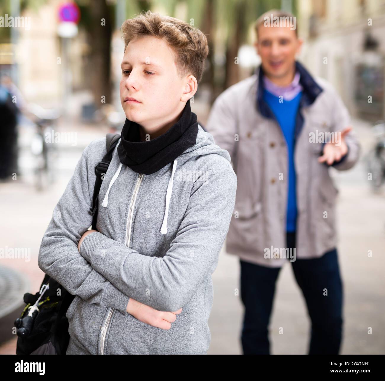 Upset teenage boy scolded by father Stock Photo - Alamy
