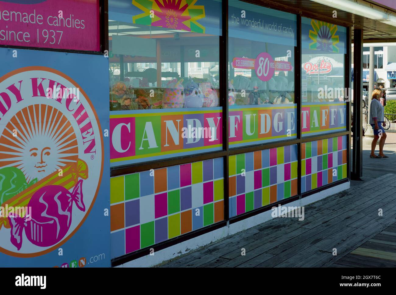 Colorful closeup of a Rehoboth Beach candy business window on the boardwalk.  Display features various candies and plush toys. Stock Photo