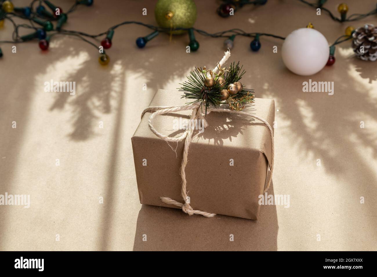 beautiful gift in the form of a box with a bow and christmas decoration, beauty in sharing Stock Photo