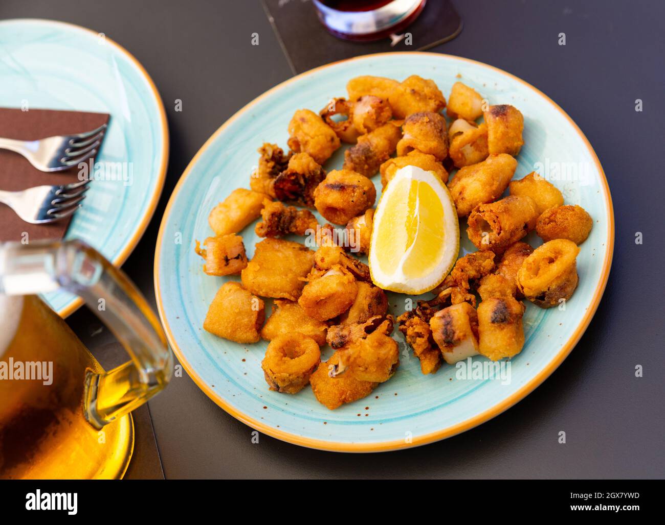 Spanish seafood dish battered fried baby squid Stock Photo Alamy