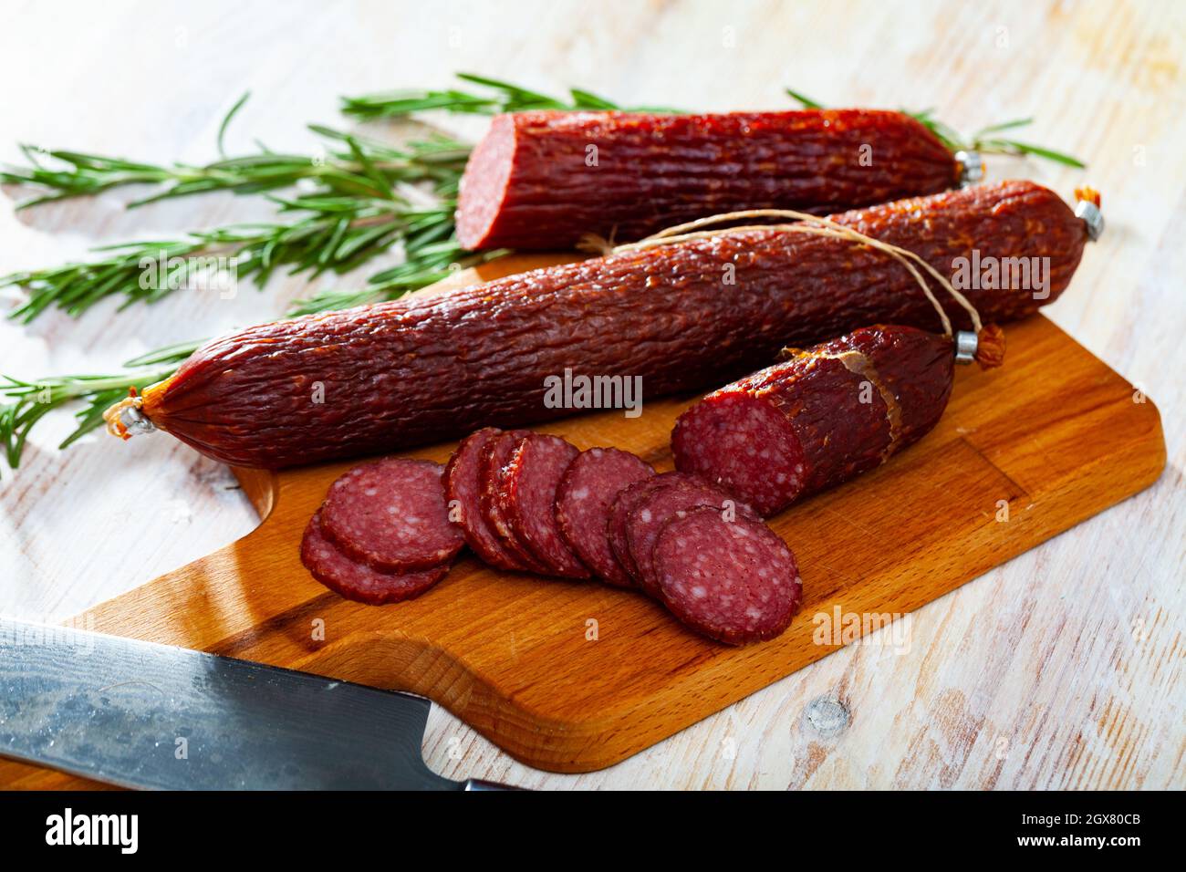 Closeup of smoked russian sausage at wooden surface Stock Photo Alamy