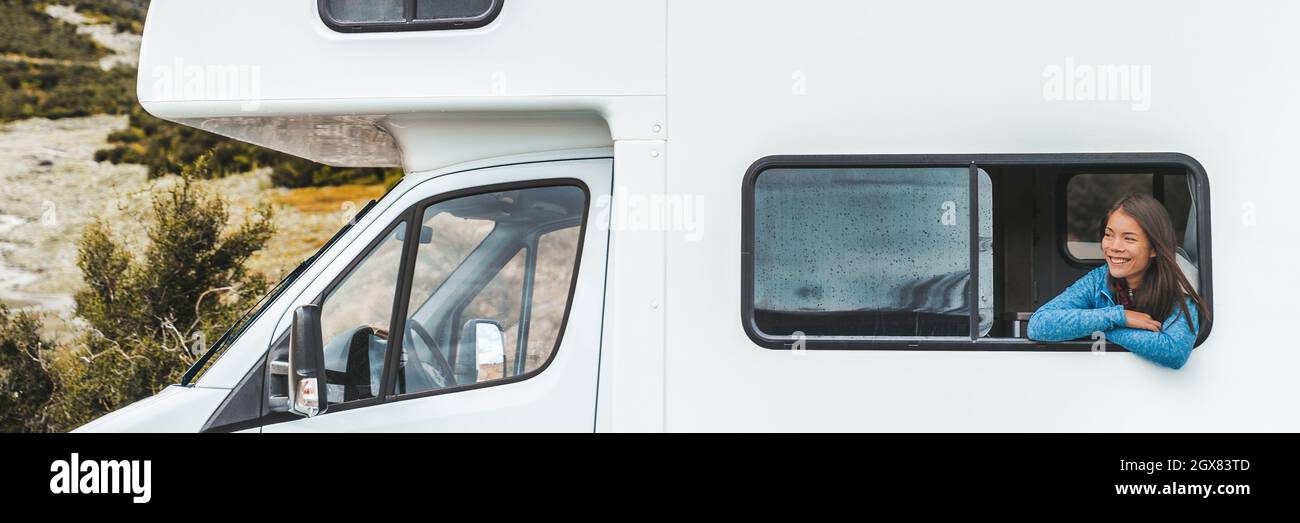 RV road trip tourist woman looking out the window of her motorhome on ...