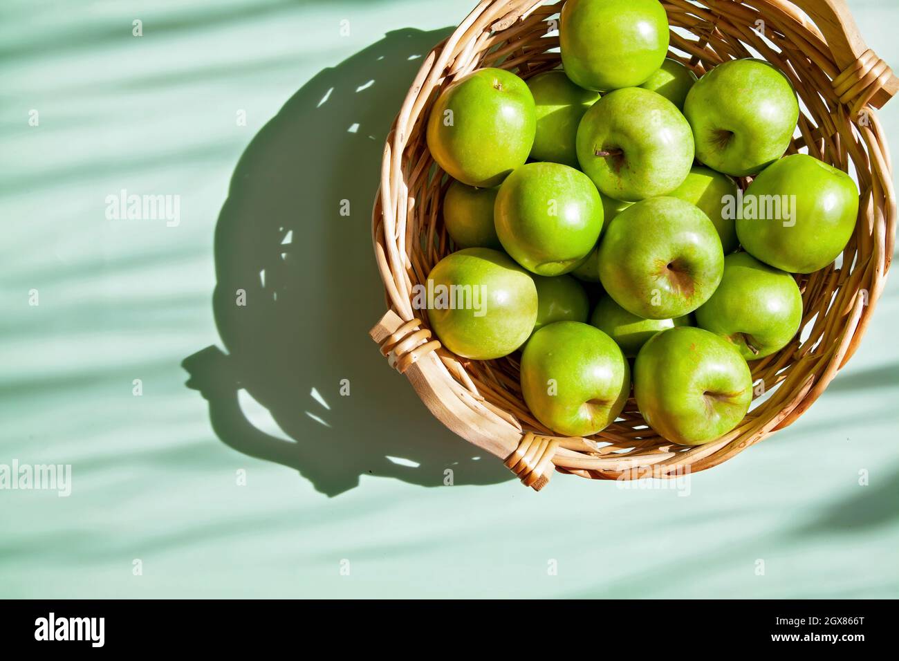 Green Apple in the Basket Stock Photo