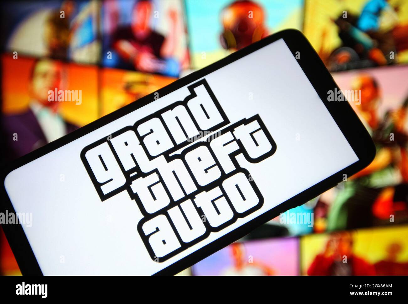 In this photo illustration a Rockstar Games logo seen displayed on a  smartphone with video games cover in the background. (Photo by Thiago  Prudencio / SOPA Images/Sipa USA Stock Photo - Alamy