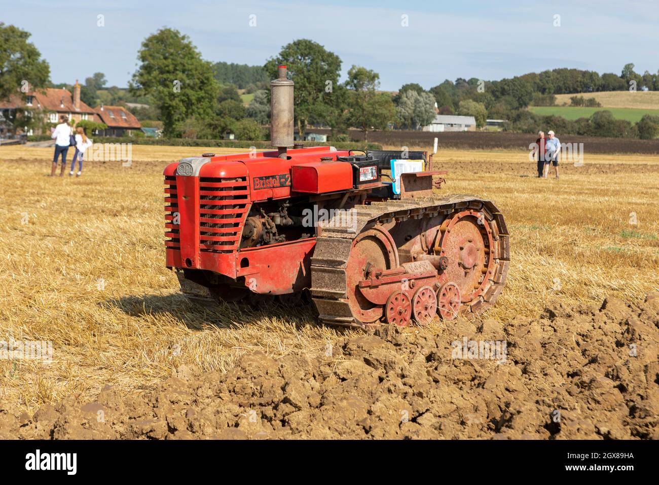 A small Bristol 20 crawler tractor in a stubble field Stock Photo