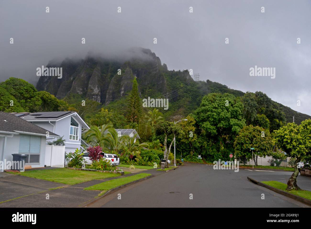 Windward Oahu neighborhood with a view of the Koolau cliffs on a cloudy