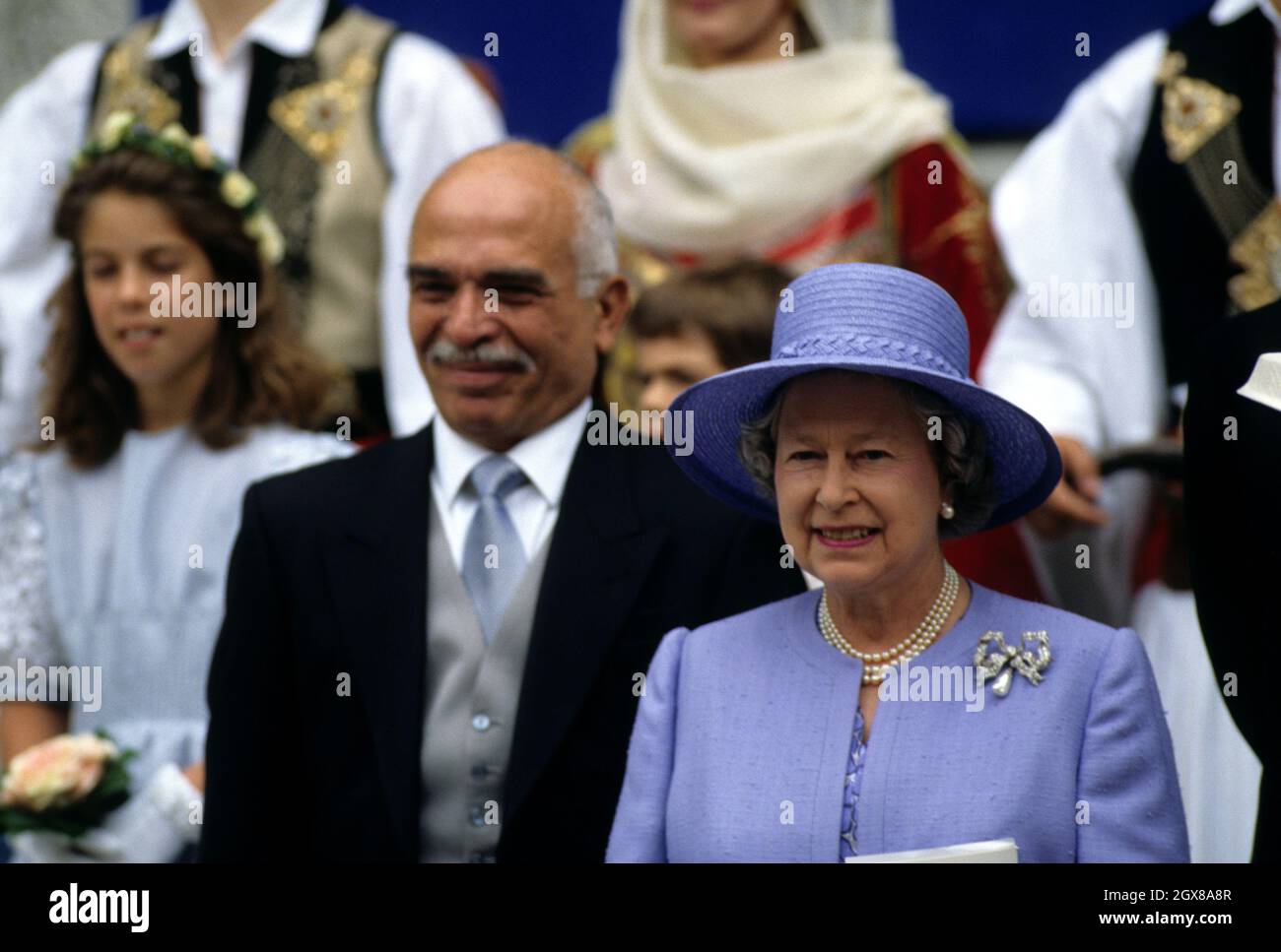 King Hussein (l) and The Queen outside St Sophia's Cathedral, London, after the wedding of Pavlos, Crown Prince of Greece and Marie-Chantal Miller Stock Photo