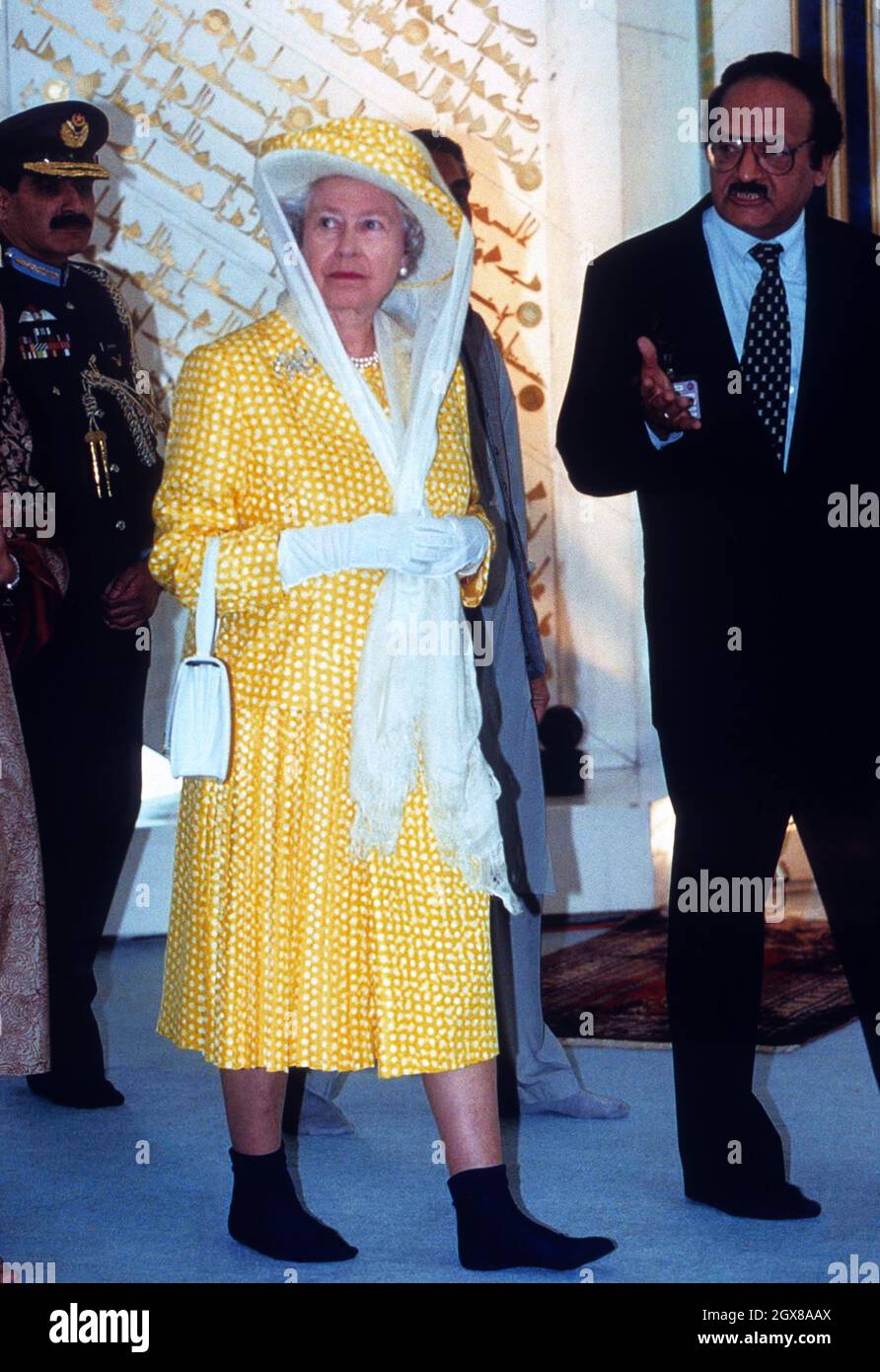 The Queen in her socks tours the Shah Faisal Mosque in Islamabad on her official visit to Pakistan. Stock Photo
