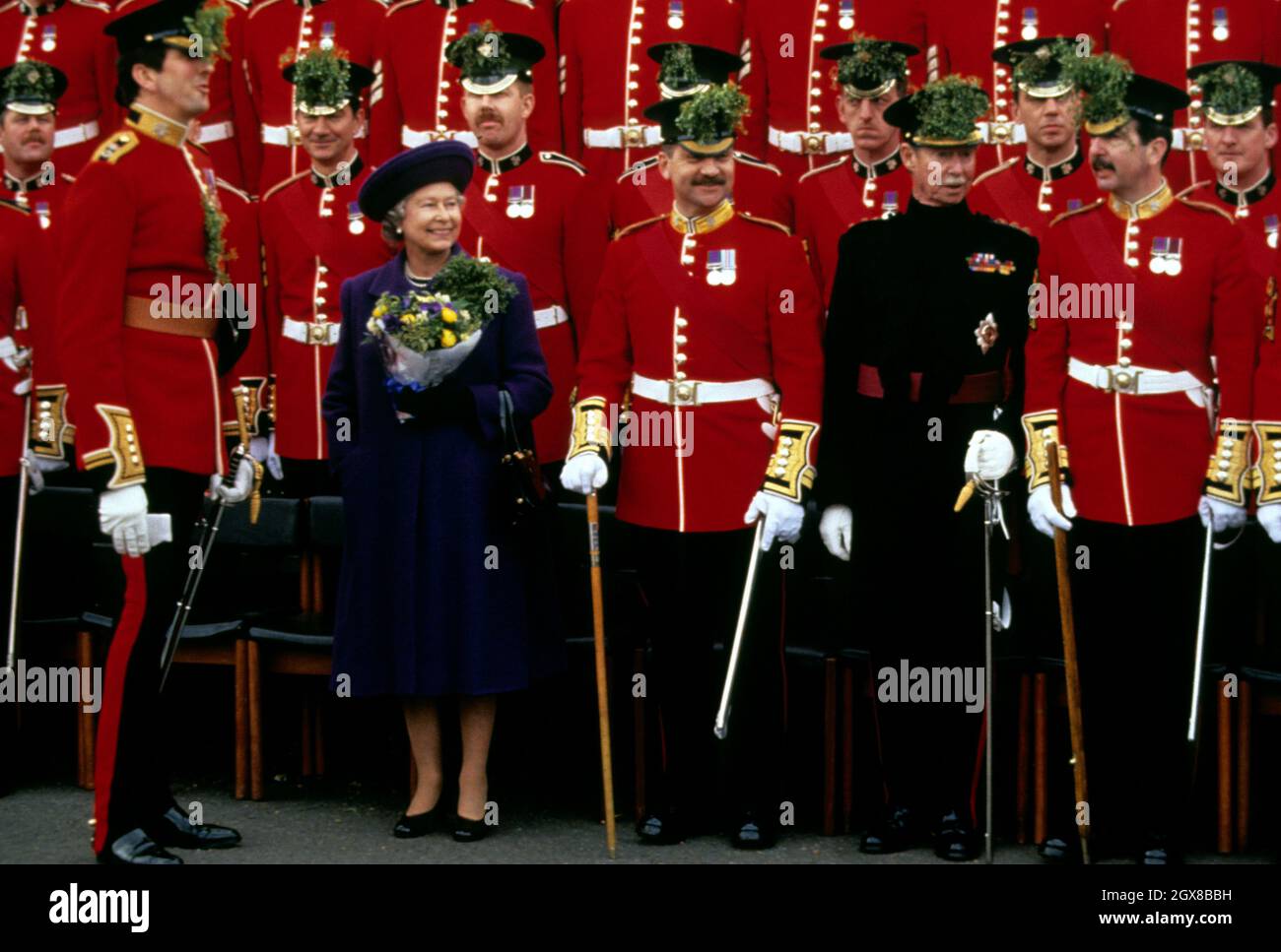 Queen Elizabeth II and and the Grand Duke of Luxembourg (wearing black) at Chelsea Army Barracks on St. Patricks Day Stock Photo