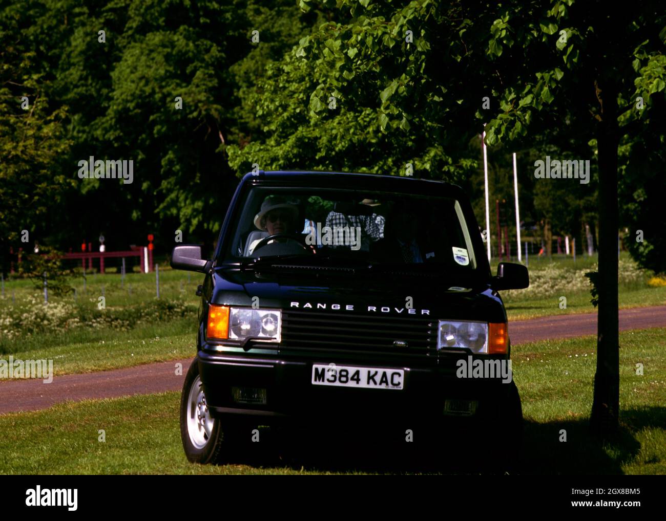 Queen Elizabeth II, at the wheel of her Range Rover, attends the Windsor Horse Trials Stock