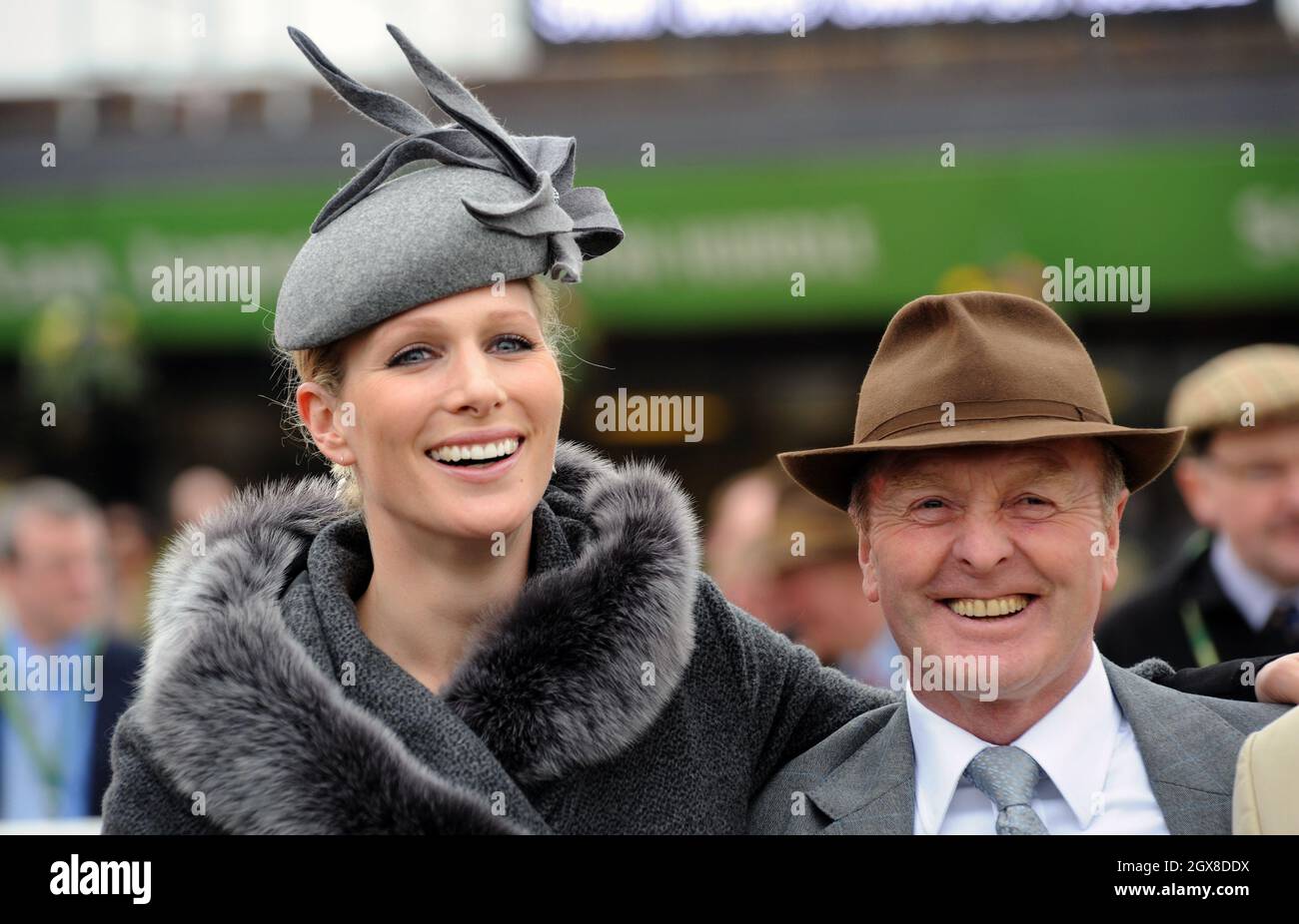 Zara Phillips and trainer Jonjo O'Neill attend the first day of of the Cheltenham Festival races Stock Photo