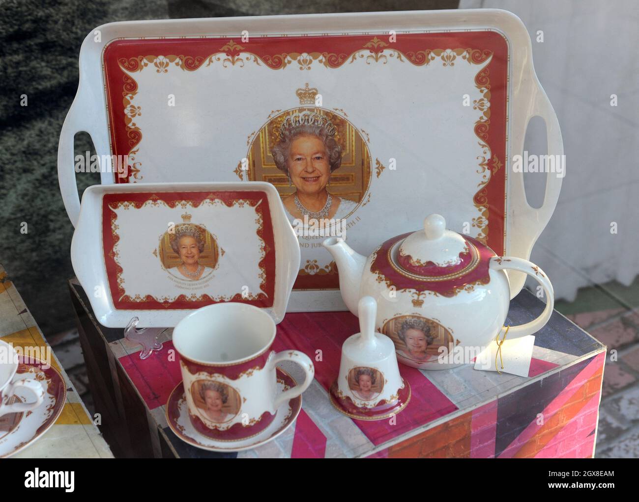 Diamond Jubilee souvenirs are displayed on a shop window in London