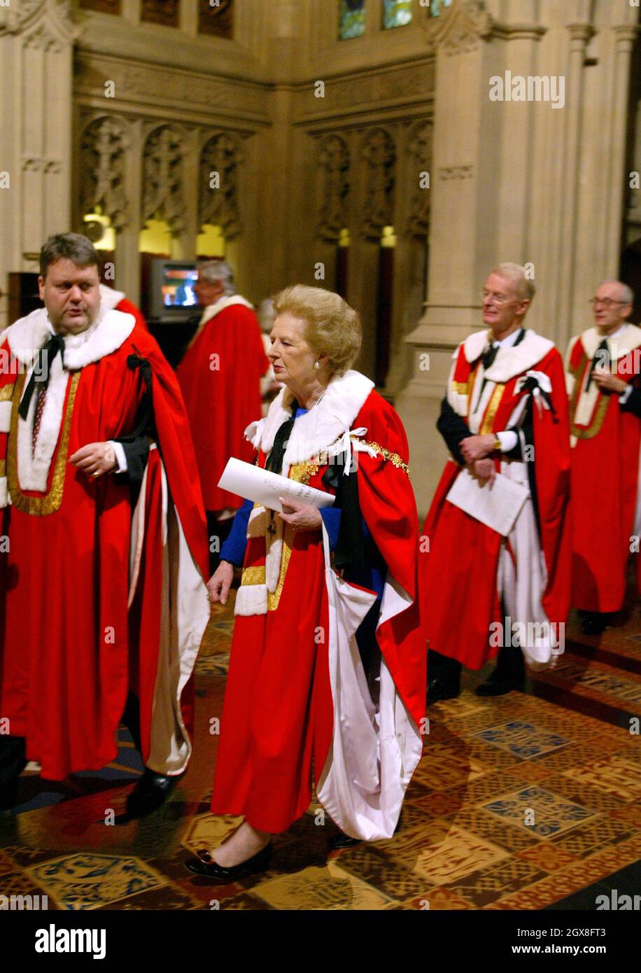 Former British Prime Minister Margaret Thatcher (C) walks through The Peers Lobby after listening to The Queen's Speech in The House of Lords during The State Opening of Parliament at The Palace of Westminster in London 23 November 2004. Stock Photo