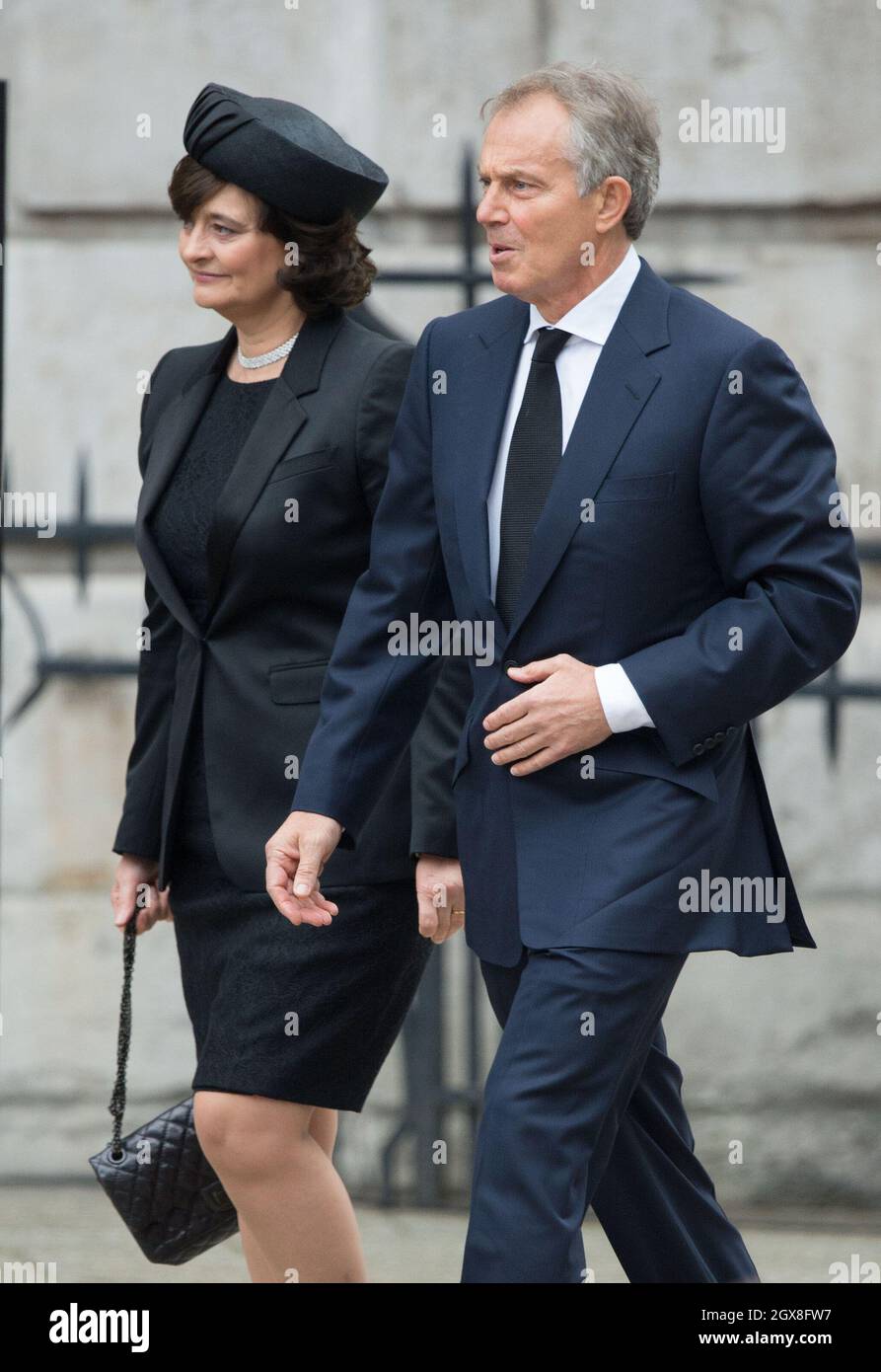 Former Prime Minister Tony Blair his wife Cherie Blair arrive for the funeral of Margaret Thatcher at St. Paul's Cathedral in London on April 17, 2013.  Stock Photo