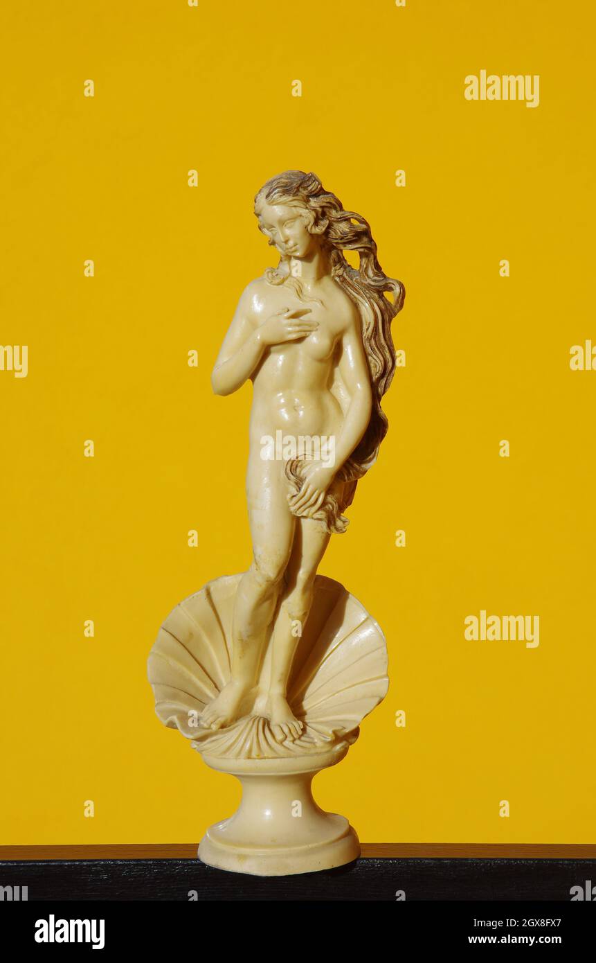 Scale reproduction after restoration of the statue representing the Birth of Venus by Botticelli on an orange background Stock Photo