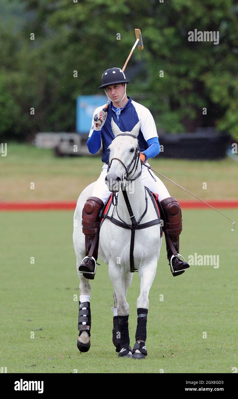 Prince William, Duke of Cambridge takes part in a charity polo match at Beaufort Polo Club in Tetbury on June 16, 2013. Stock Photo