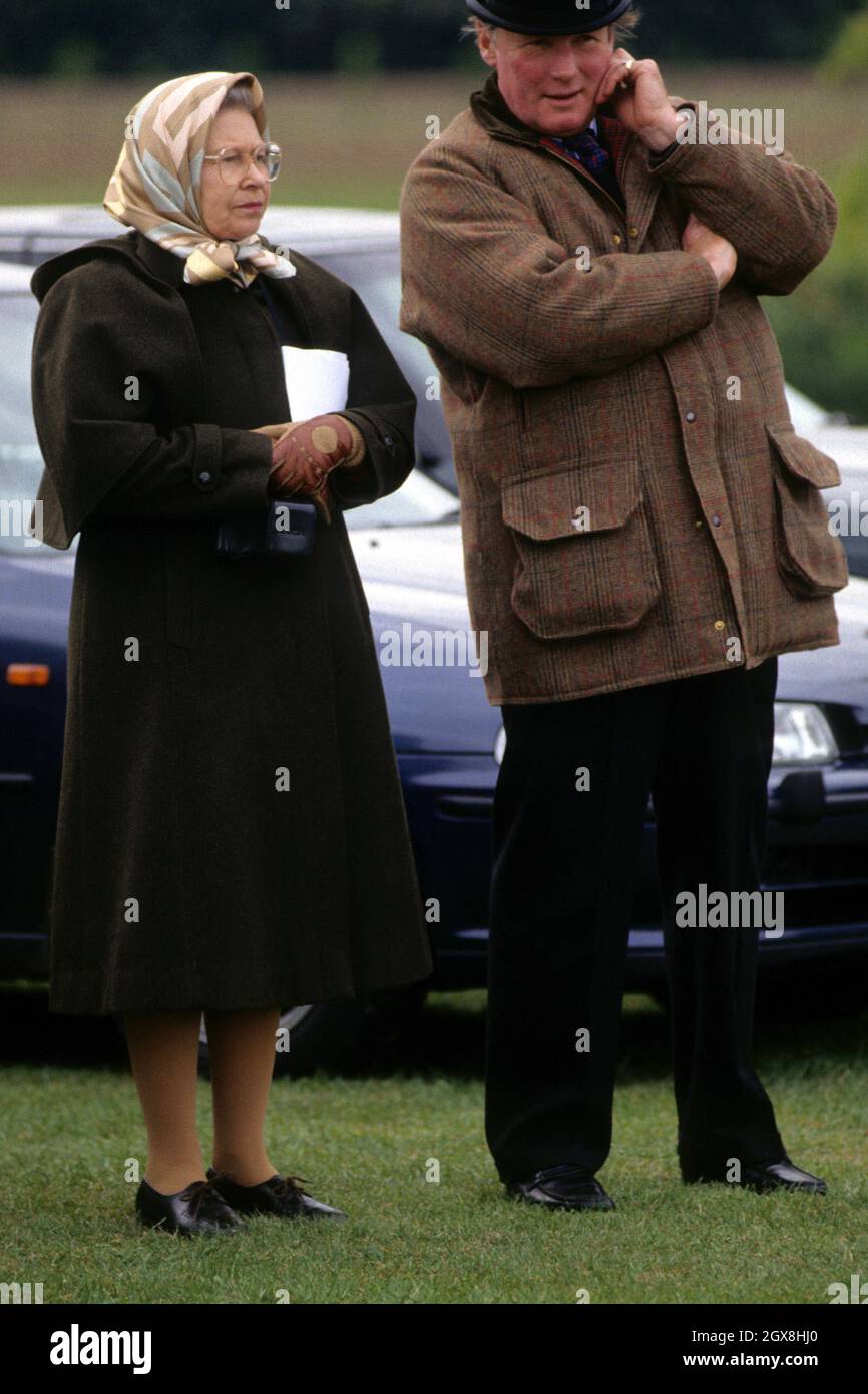 Queen Elizabeth II and Horse Trainer Howard Johnson attending the