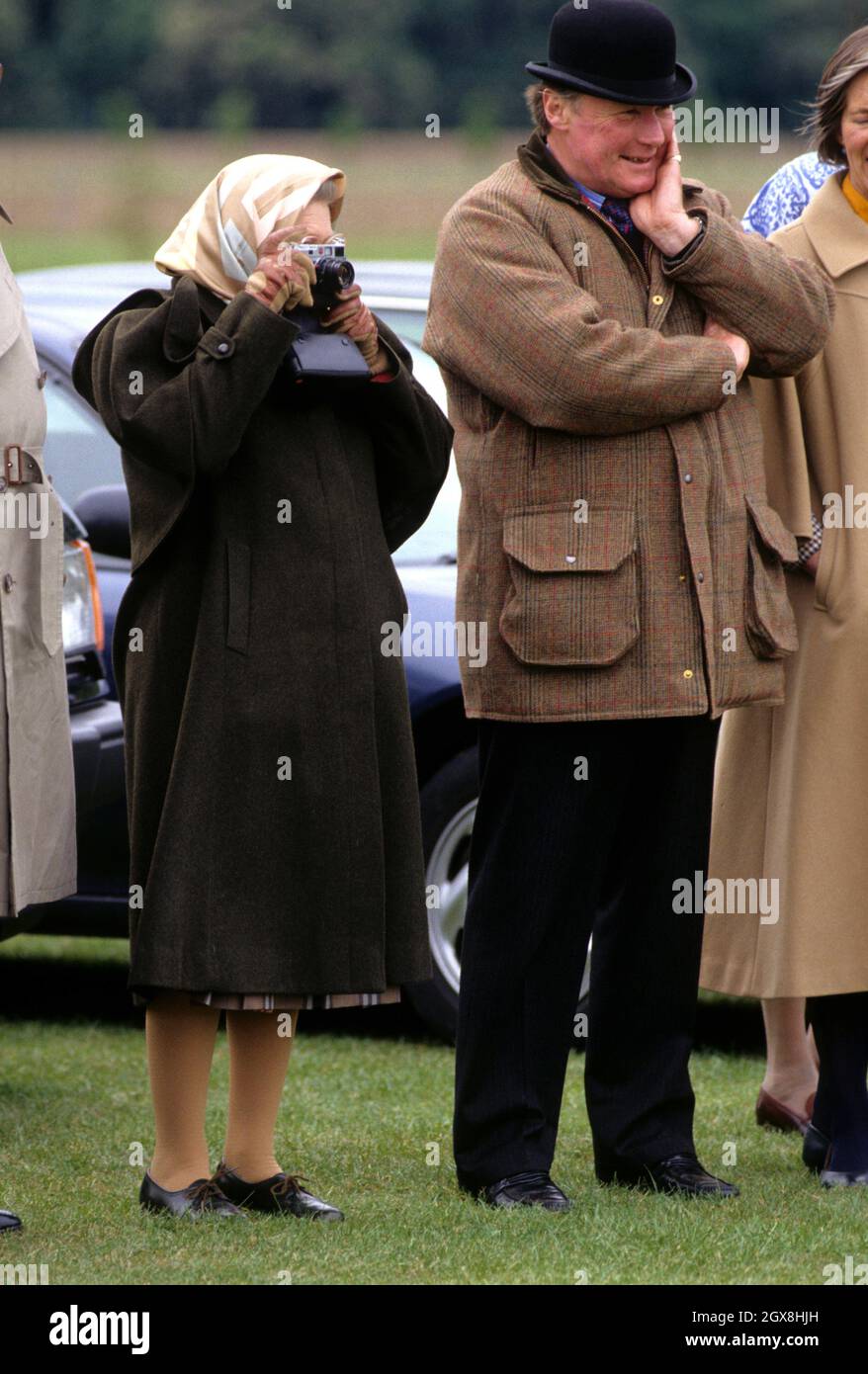 Queen Elizabeth II and Horse Trainer Howard Johnson attending the