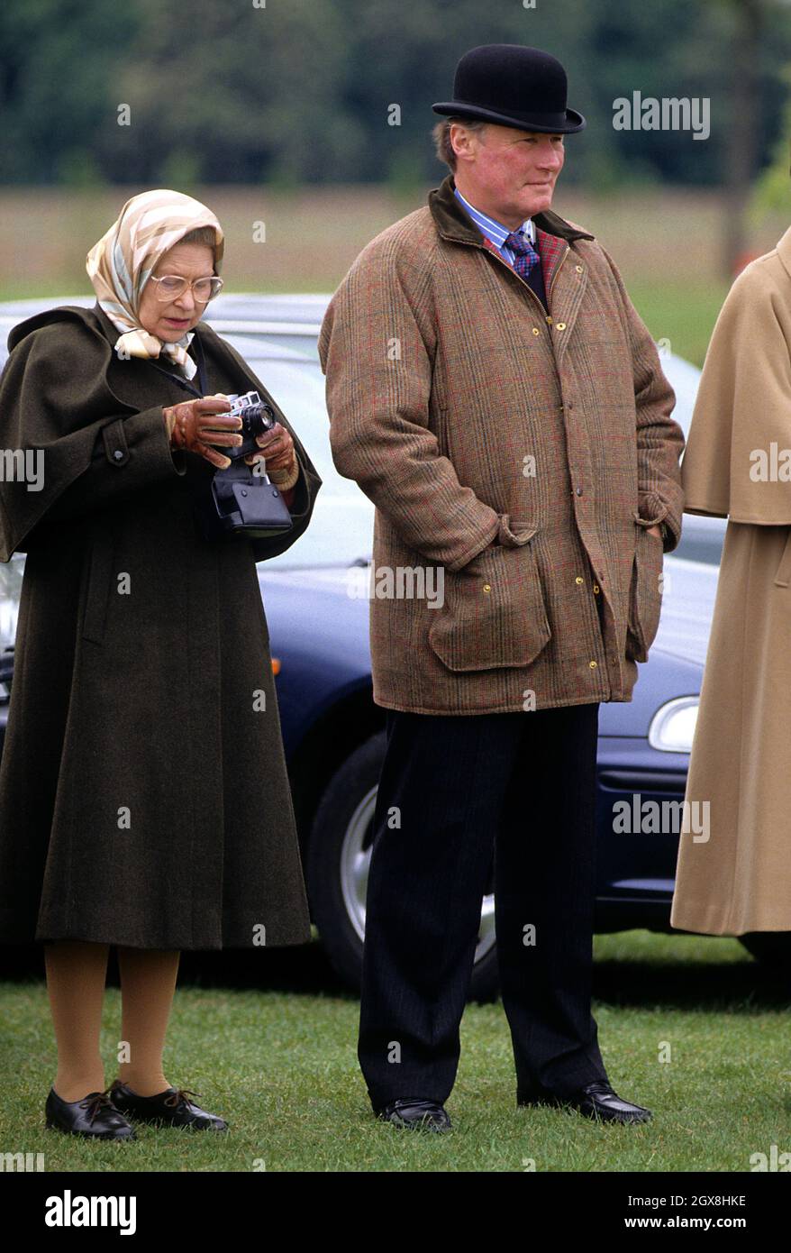 Queen Elizabeth II and Horse Trainer Howard Johnson attending the