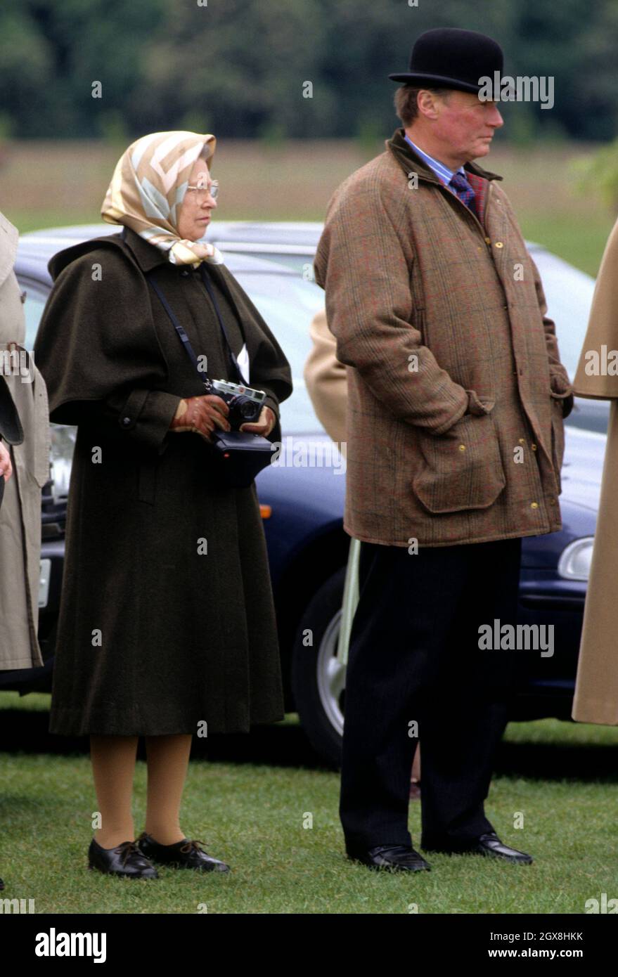 Queen Elizabeth II and Horse Trainer Howard Johnson attending the