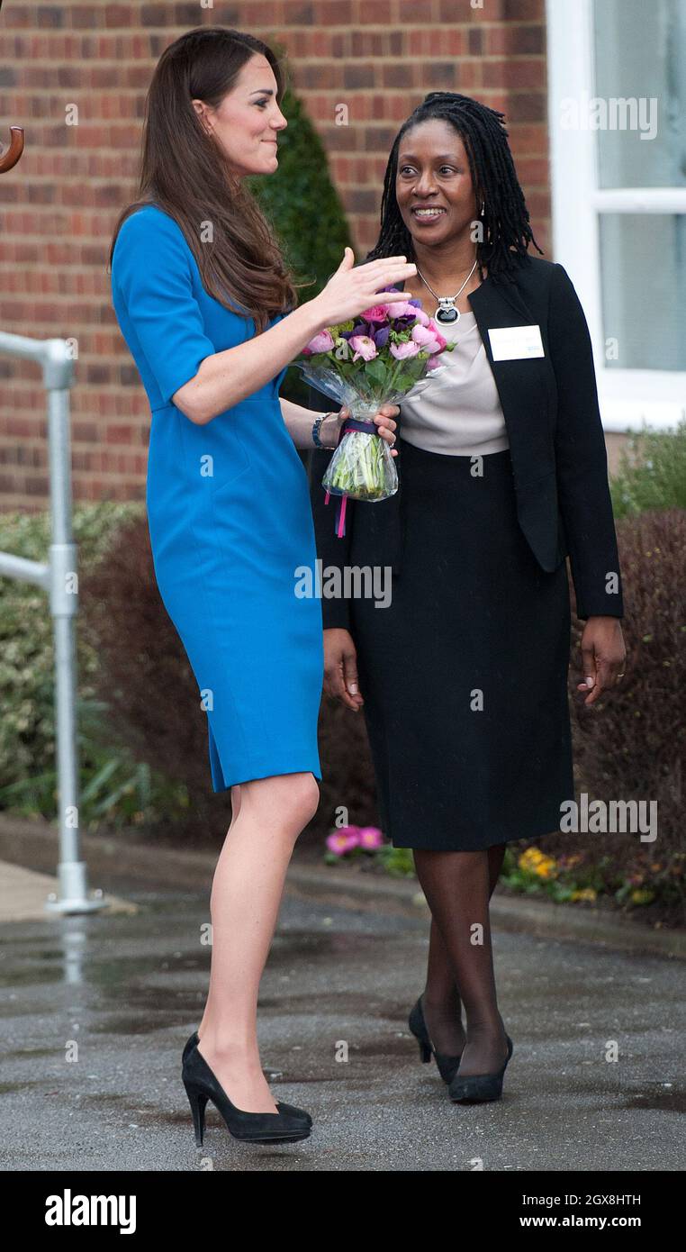 Catherine, Duchess of Cambridge, wearing a royal blue LK Bennett dress, officially opens the ICAP Art Room at Northolt High School in Ealing, London. Stock Photo