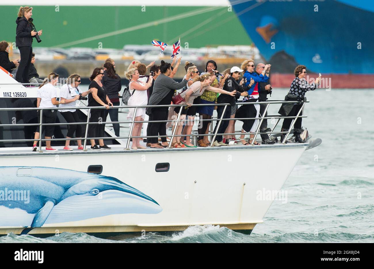Royal fans follow by boat to watch Catherine, Duchess of Cambridge and Prince William, Duke of Cambridge race America's Cup yachts in Aukland Harbour, New Zealand on April 11, 2014.    Stock Photo