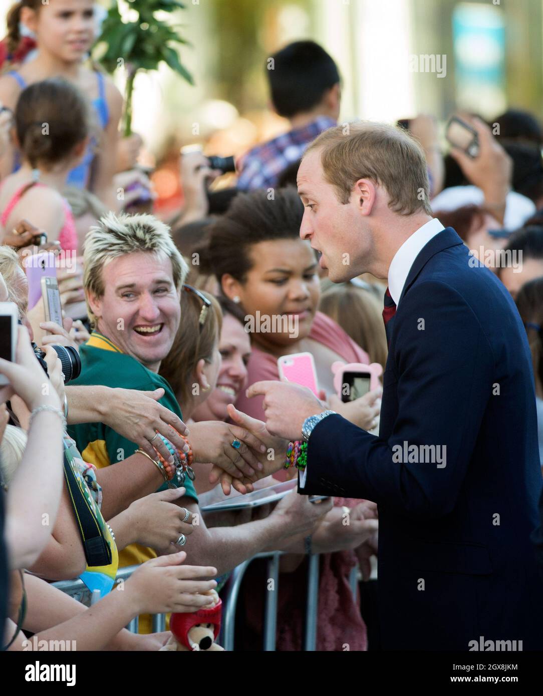Prince William, Duke of Cambridge greets well wishers during a walkabout in Brisbane, Australia on April 19, 2014. The Duchess is wearing a blue and white LK Bennett dress    Stock Photo