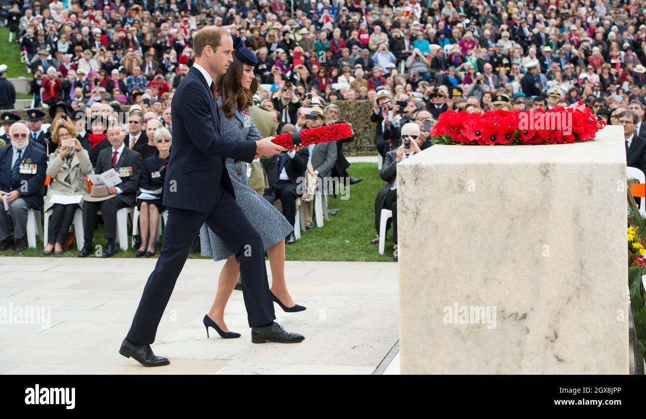 Catherine, Duchess of Cambridge and Prince William, Duke of Cambridge lay a wreath as they attend the ANZAK Day Service at the Australian War Memorial in Canberra, Australia on April 25, 2014. The Duchess is wearing a blue hat by Australian milliner Jonathan Howard Stock Photo