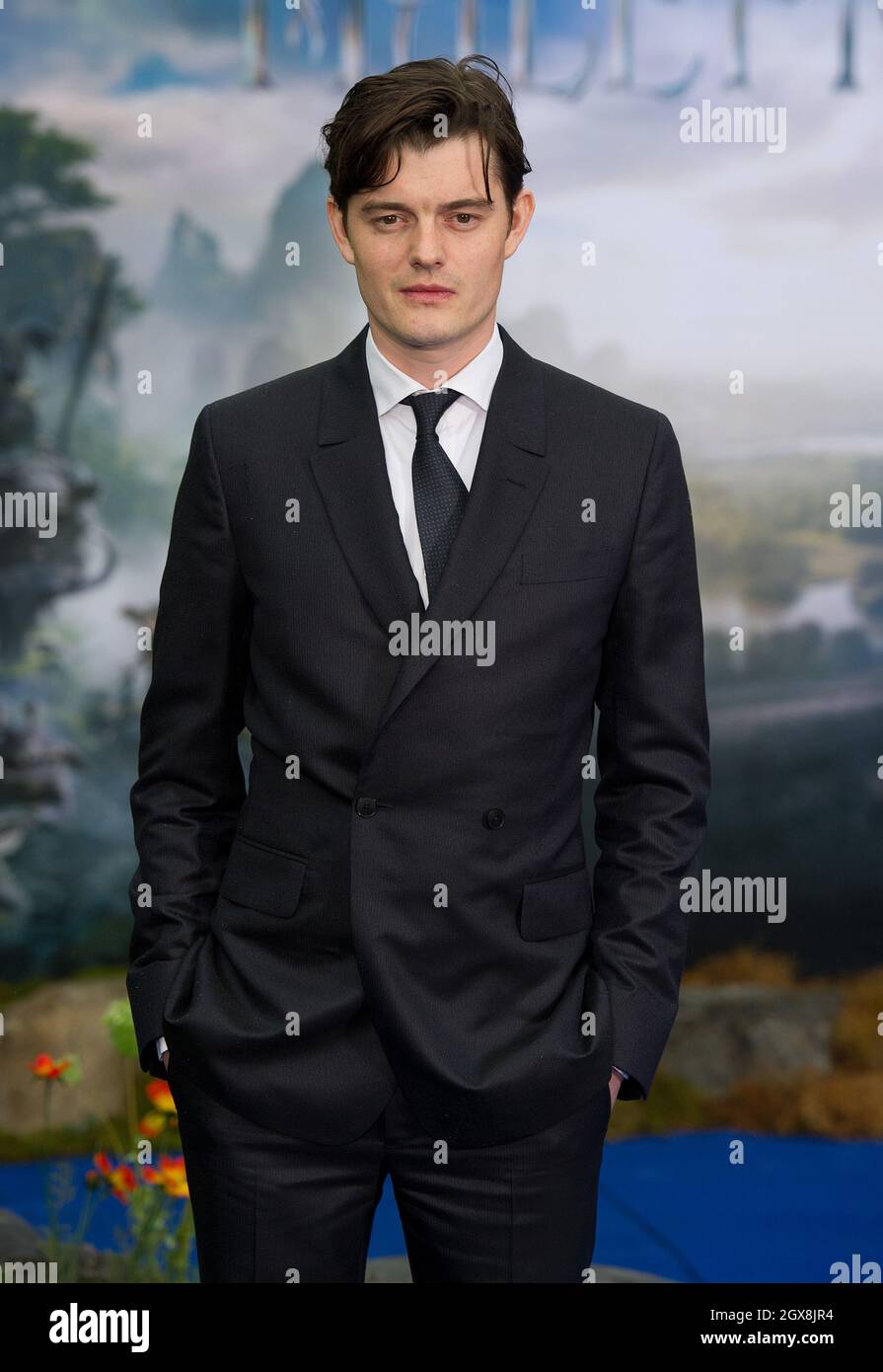 Sam Riley attends a private reception as costumes and props from Disney's 'Maleficent' are exhibited in support of Great Ormond Street Hospital at Kensington Palace in London. Stock Photo