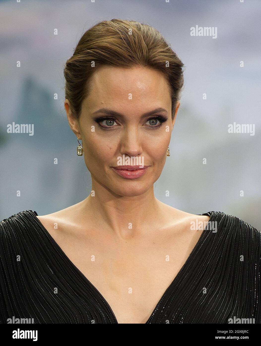 Angelina Jolie attends a private reception as costumes and props from Disney's 'Maleficent' are exhibited in support of Great Ormond Street Hospital at Kensington Palace in London. Stock Photo
