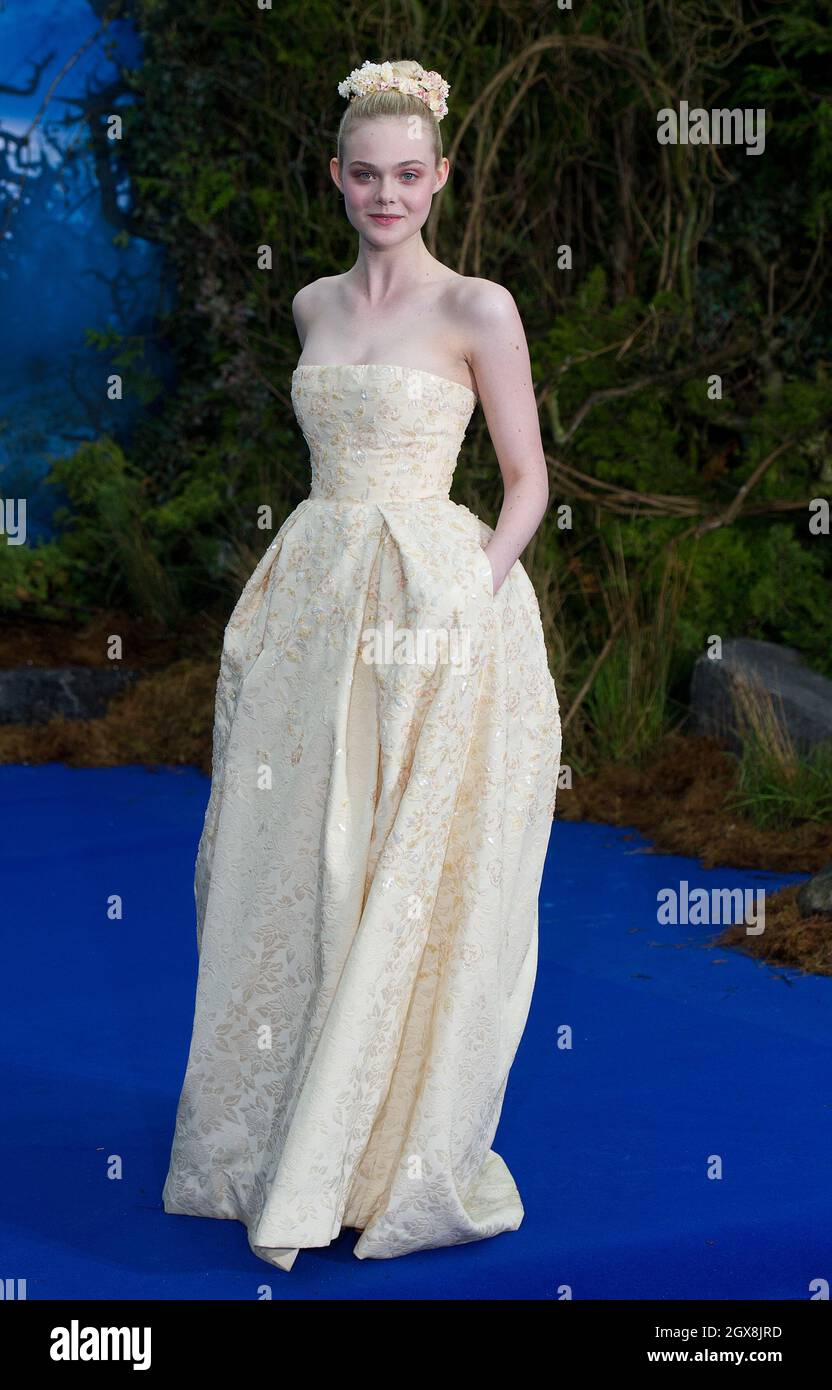 Elle Fanning attends a private reception as costumes and props from Disney's 'Maleficent' are exhibited in support of Great Ormond Street Hospital at Kensington Palace in London. Stock Photo