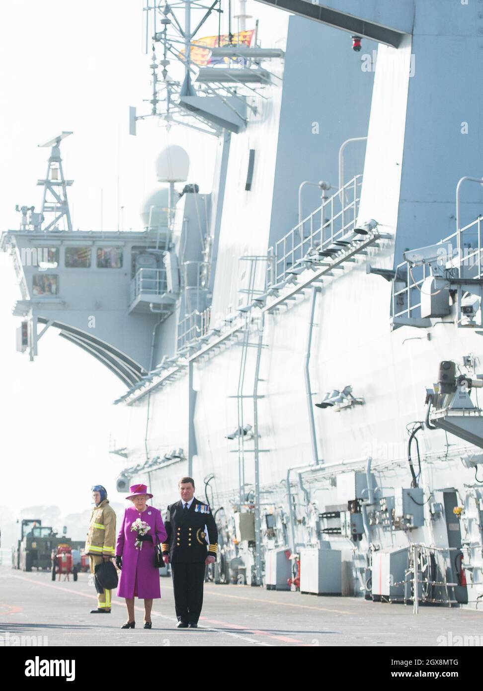 Queen Elizabeth ll visits the flight deck during a visit to HMS Ocean in Plymouth on March 20, 2015.     Stock Photo