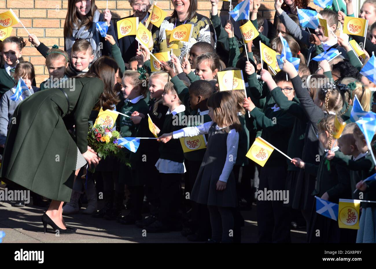 Catherine, Duchess of Cambridge wears a Max Mara green coat when she visits  the children's mental health charity Place2Be at St Catherine's Primary  School in Edinburgh, Scotlands Stock Photo - Alamy