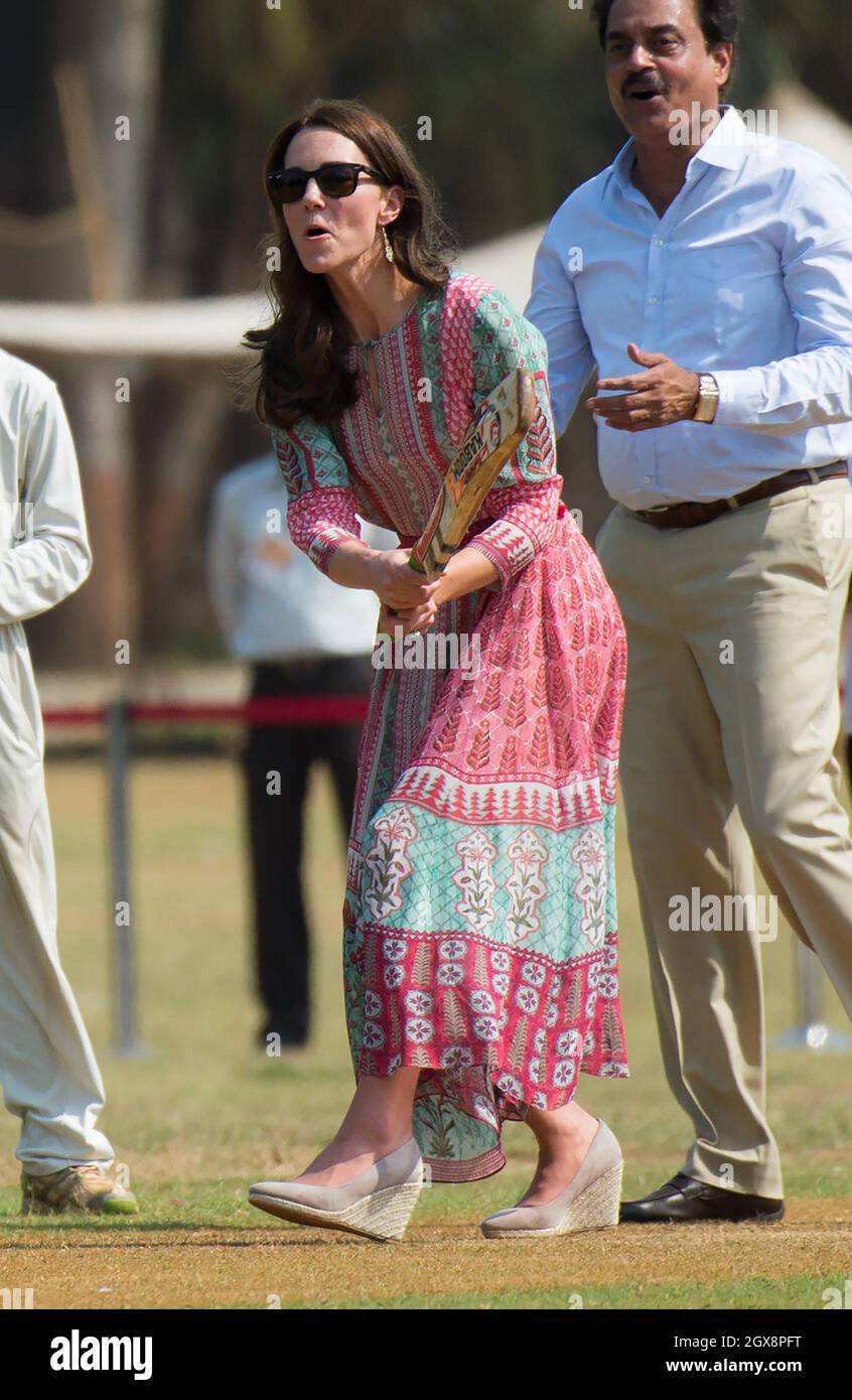 Catherine Duchess of Cambridge wearing a printed dress by Indian designer Anita Dongre takes part in a children s cricket match at the Oval Maidan in Mumbai India on April 10 2016 Stock