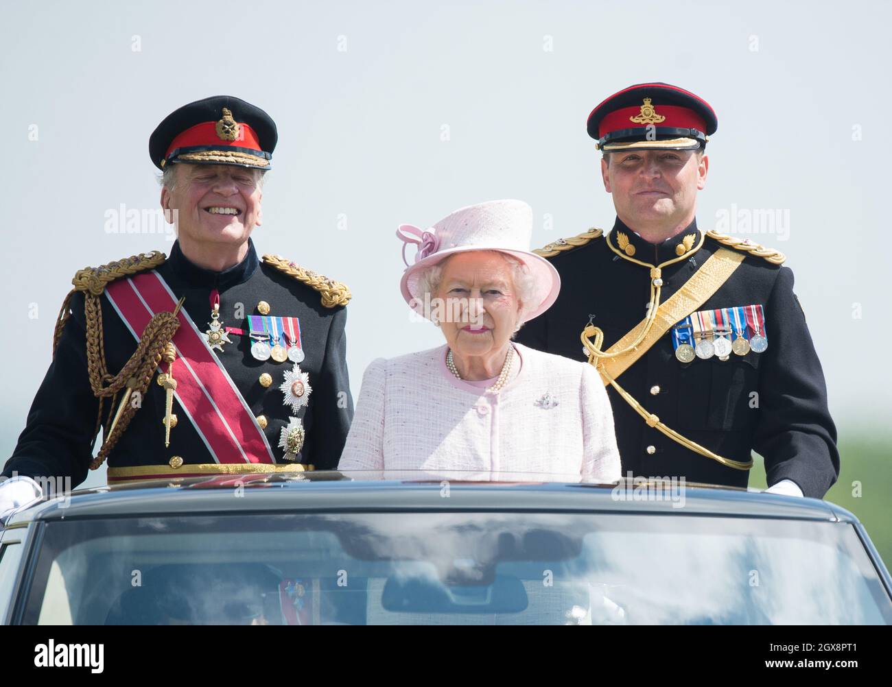 Queen Elizabeth II, Captain-General of The Royal Artillery, overseas a Review of The Royal Artillery from an open-topped Range Rover on the occasion of their Tercentenary at Knighton Down, Larkhill on May 26, 2016. Stock Photo