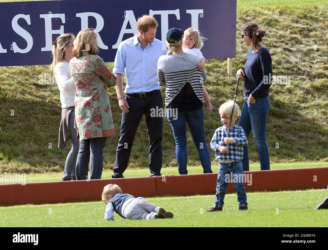 Prince Harry chats with Zara Tindall and Mia Tindall during the Maserati Charity Polo match at the Gloucestershire Festival of Polo at the Beaufort Polo Club on June 18, 2016. Stock Photo
