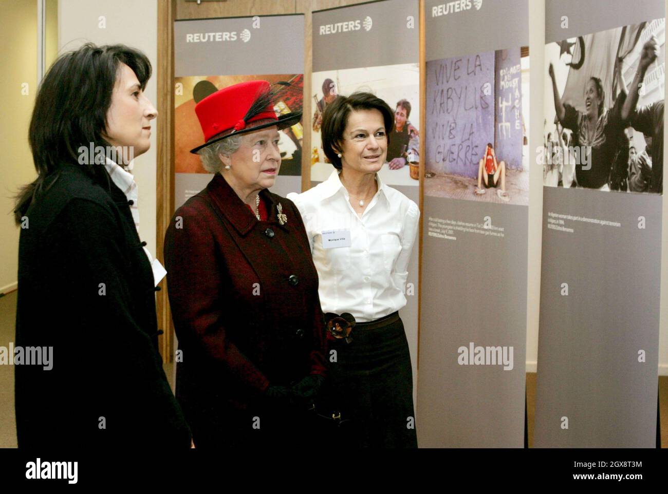 Queen Elizabeth II is shown a photographic exhibition of pictures by Reuters photographer Zohra Bensemra by Reuters' Senior Vice President and Global Head of News and Pictures, Monique Villa, during a visit to the Reuters building at Canary Wharf in London. The Queen visited Reuters' new global headquarters and then sent a simulated despatch to mark the official opening of the building. Anwar Hussein/allactiondigital.com Stock Photo