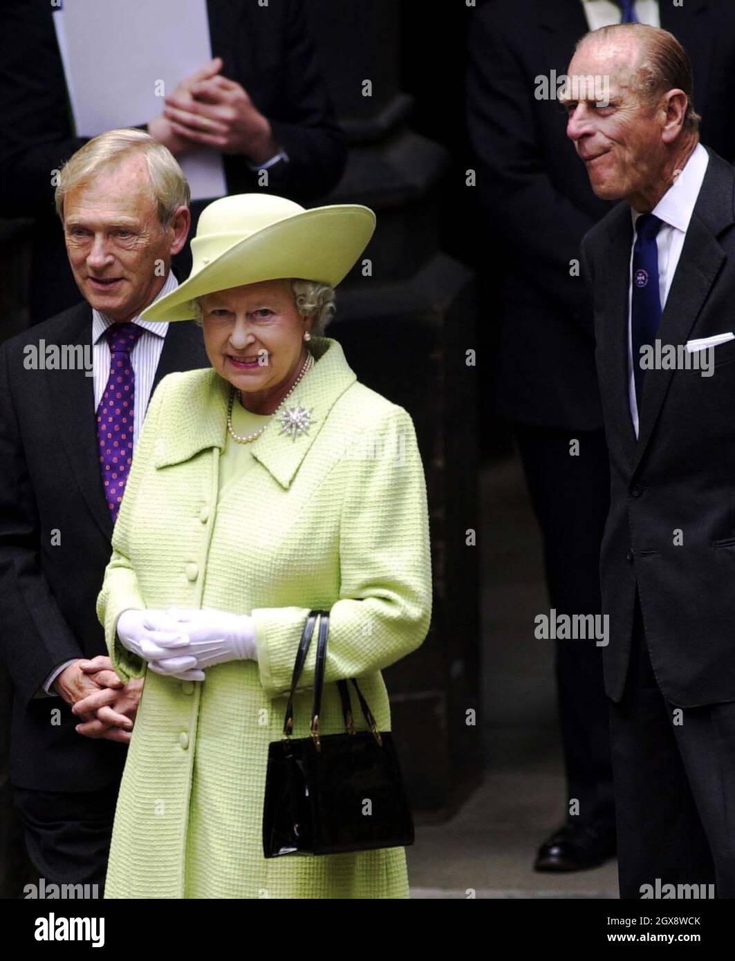 The Queen and Duke of Edinburgh, accompanied by the Presiding Officer George Reid,  at the Scottish Parliament in Edinburgh, where she was meeting party leaders. Half length, Royals, green hat  Stock Photo