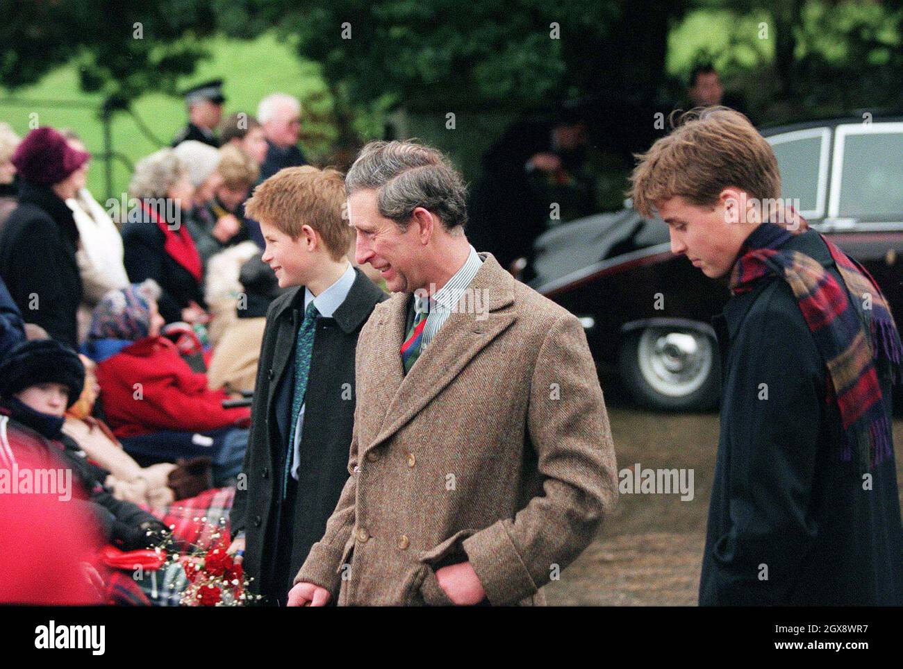 The Prince of Wales with sons Prince Harry and Prince William after the Sandringham Christmas day church service in 1998.  Photo.  Anwar Hussein  Stock Photo