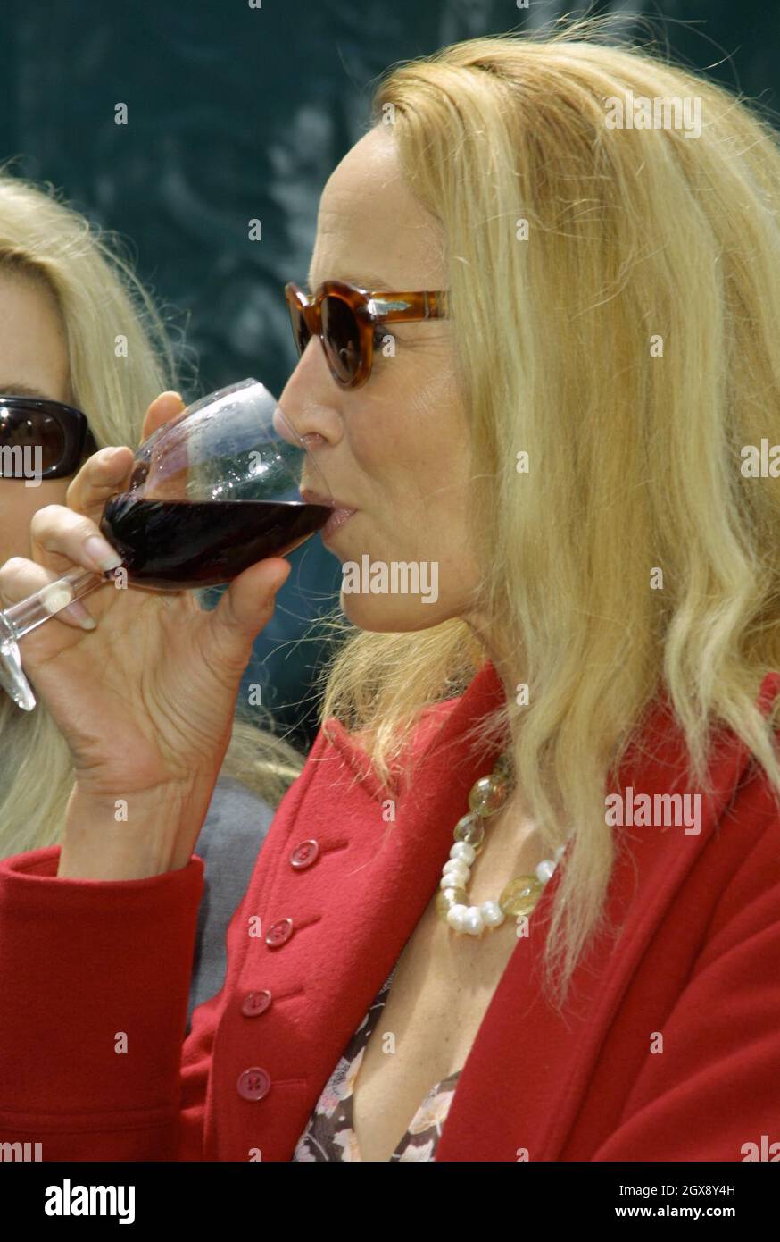 Jerry Hall  at the RHS Chelsea Flower show 2003, London. Headshot, drinking red wine. Â©Jean/allaction.co.uk  Stock Photo