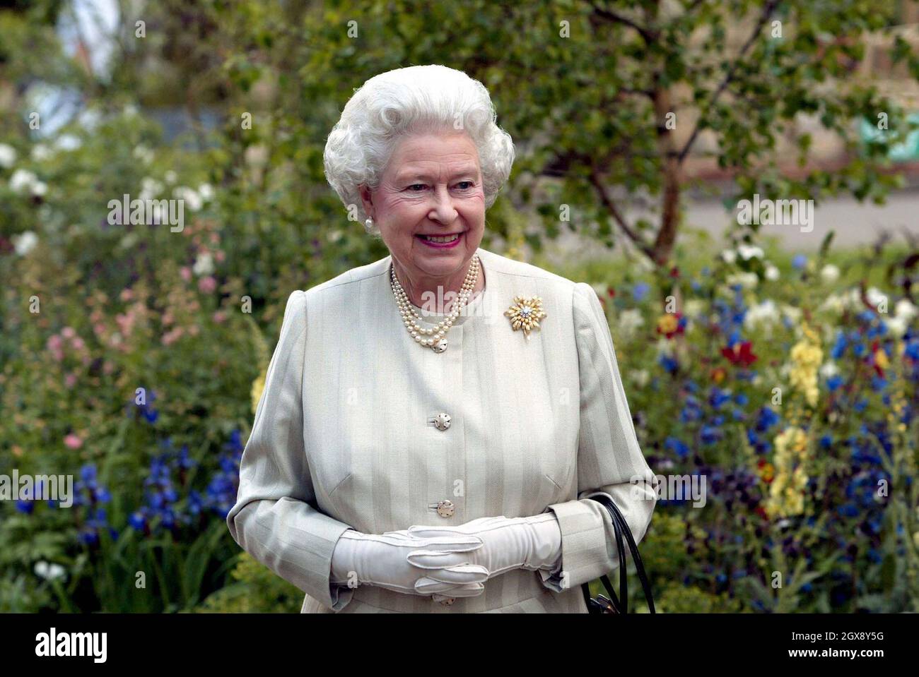 The Queen examines exhibits during her visit to the Royal Horticultural Society's Chelsea Flower Show in London. Half length, Royals  Â©Anwar Hussein/allaction.co.uk  Stock Photo