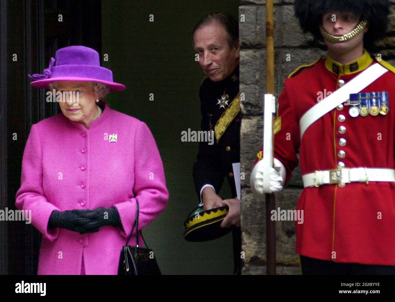 Her Majesty Queen Elizabeth II at Crown Square, Edinburgh Castle for  a reception of The Royal Scots Dragoon Guards.   half length. purple. hat. royal.   Stock Photo