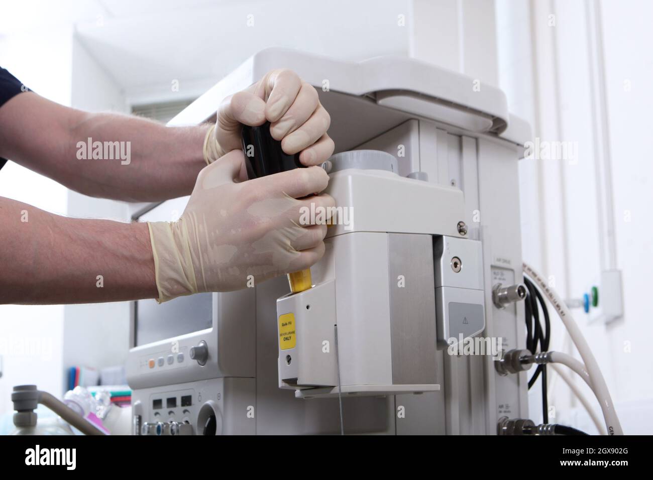 Anesthesiologist prepares the equipment for the operation under general
