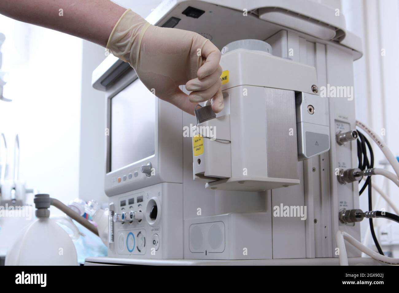 Anesthesiologist prepares the equipment for surgery under general