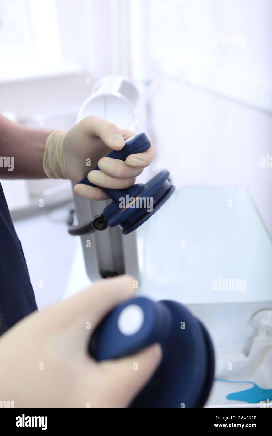 Preparation for defibrillation. The electrodes are in the hands of the