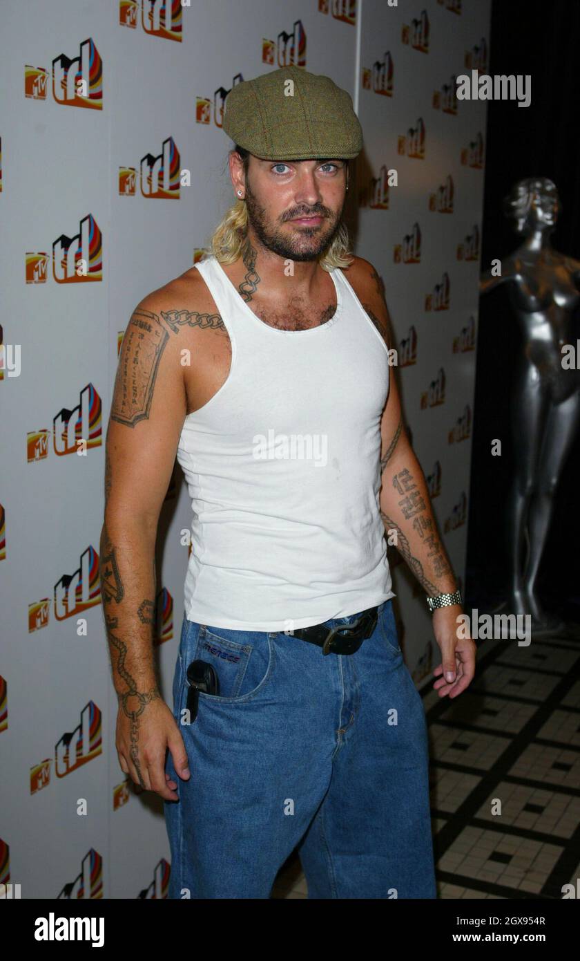 Shane Lynch at the launch of the new Mtv show, TRL Live, at the In and Out Club, London.  Flat cap, hat, tattoos, beard, stubble, vest. Stock Photo