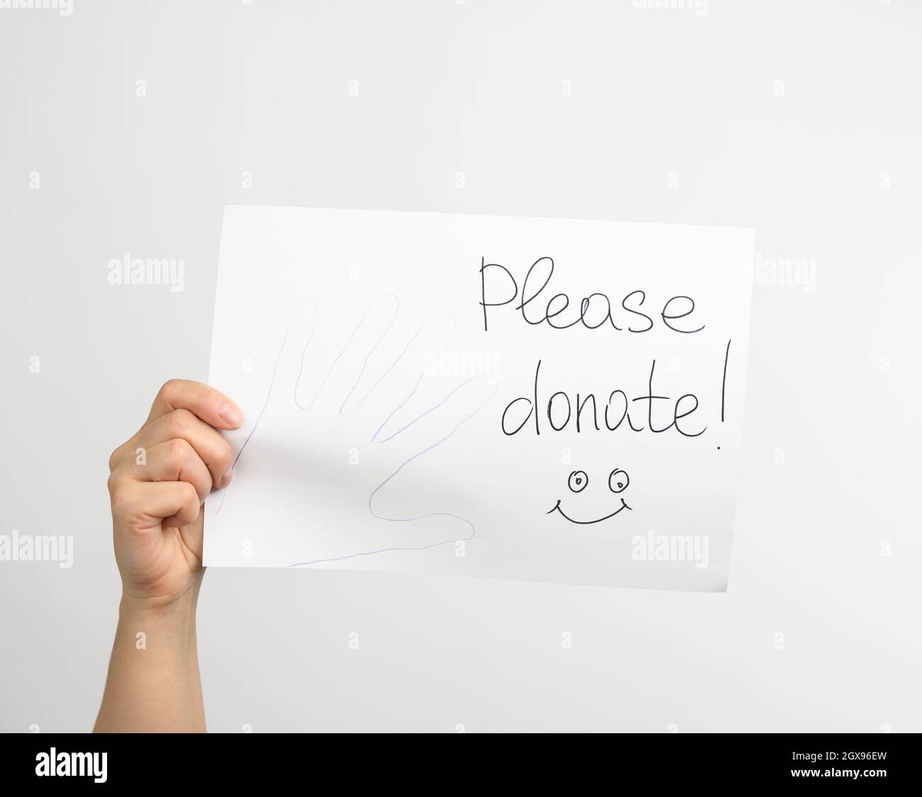 Please donate words written on white board Stock Photo - Alamy